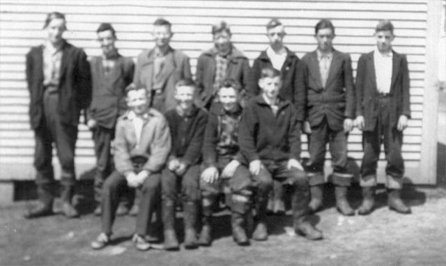 532: Group of 11 boys. (circa 1950) [courtesy of Lorna Richardson] / photo is not sharp /  ** also see 531 **  Standing left-to-right, Bill Barry, Vince Norman, Vince Carroll, Dave Ryan, Charlie Norman,  unidentified, Vince Ennis;  sitting left-to-right, Ray Carroll, Pat Ryan, ? Barry, unidentified.  - Bill Barry (of Thomas Barry &amp;amp; Anne Dollimont)  - Ray Carroll (of Michael Carroll &amp;amp; Josephine Barry)  - Vince Carroll (of Michael Carroll &amp;amp; Josephine Barry)  - Vince Ennis (of Vincent Ennis &amp;amp; Mary Carroll)  - Charlie Norman (of Charles Norman &amp;amp; Elizabeth Anne Barry)  - Vince Norman (of Peter Norman &amp;amp; Margaret Norman)  - Dave Ryan (of Jeremiah Ryan &amp;amp; Josephine Lambe)  - Pat Ryan (of Albert Ryan &amp;amp; Catherine Nolan)